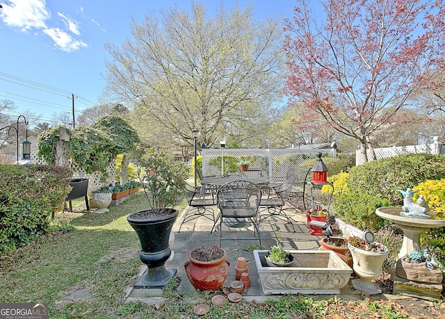 151 Flat Shoals Rd, Woodbury, GA 30293 - view of yard with outdoor dining area, a patio, and fence