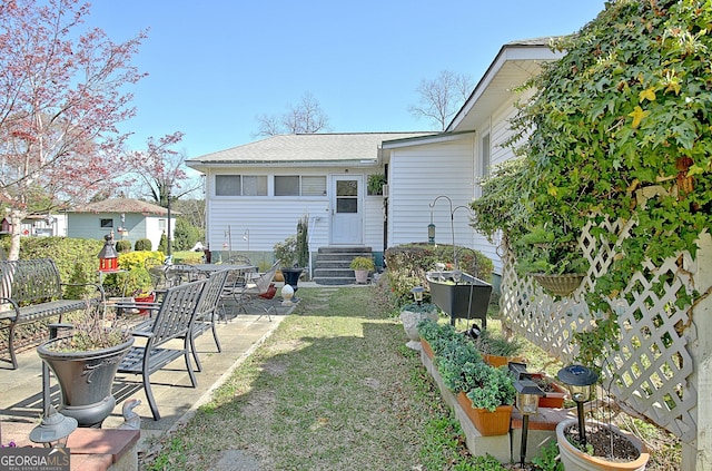 151 Flat Shoals Rd, Woodbury, GA 30293 - view of yard featuring a patio area, entry steps, and a vegetable garden