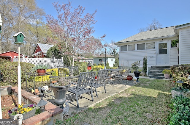 151 Flat Shoals Rd, Woodbury, GA 30293 - view of yard featuring entry steps, a patio, and fence