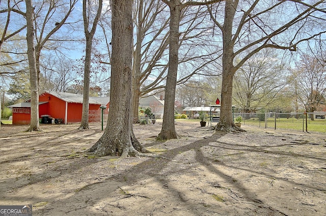 151 Flat Shoals Rd, Woodbury, GA 30293 - view of yard with an outdoor structure, fence, and a pole building