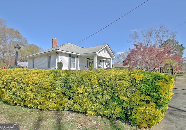 151 Flat Shoals Rd, Woodbury, GA 30293 - view of property exterior with a chimney
