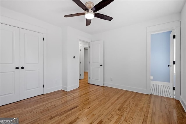 5225 Maple Valley Rd SW, Mableton, GA 30126 - unfurnished bedroom featuring light wood-type flooring, a closet, ensuite bath, and ceiling fan