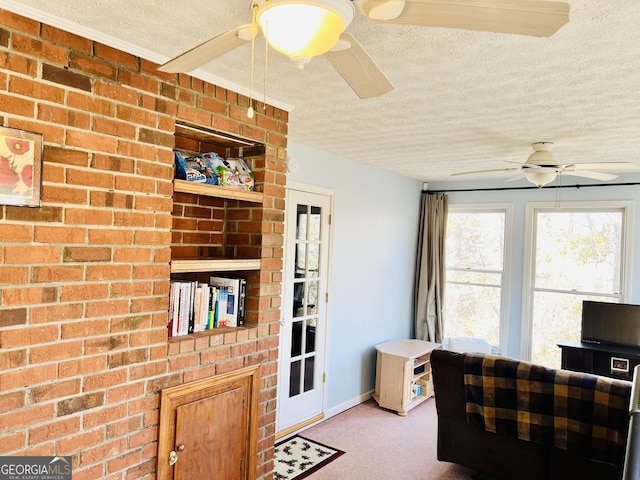 285 W0Lf Den Rd, Royston, GA 30662 - living room with a ceiling fan, a textured ceiling, and carpet floors