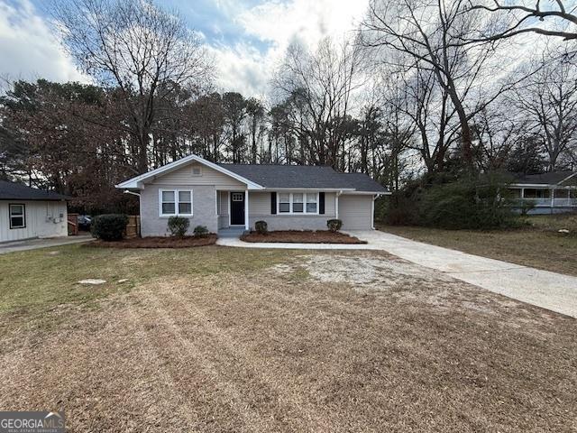 1643 Columbia Dr, Decatur, GA 30032 - single story home with an attached garage, concrete driveway, and a front yard
