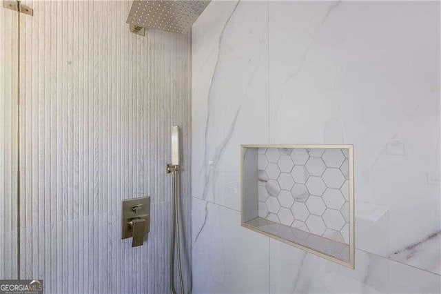 room details with a tile shower