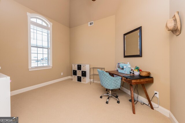 carpeted home office with baseboards