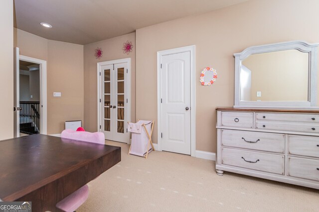 hall featuring light carpet, baseboards, and ornamental molding