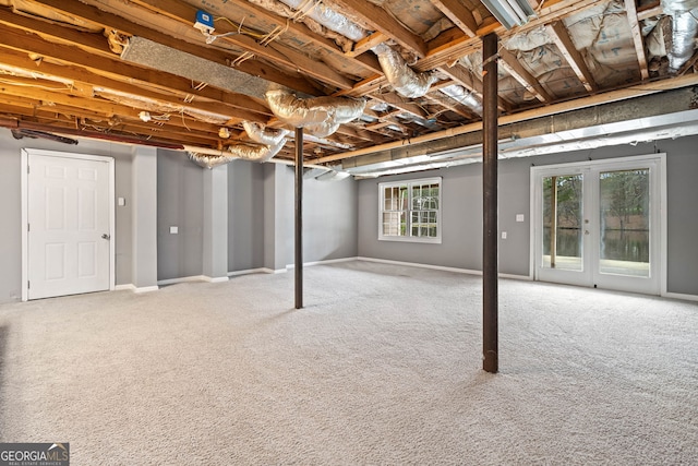 below grade area featuring baseboards and carpet