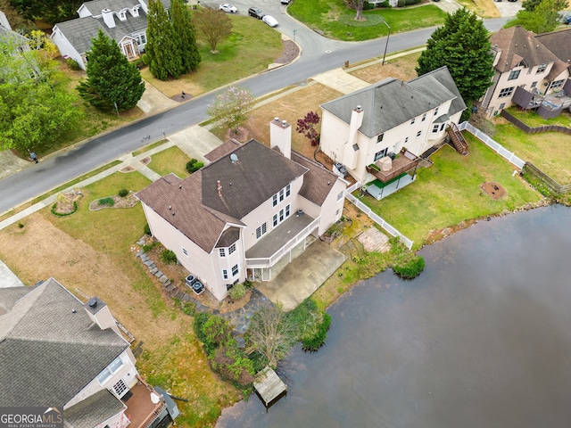 aerial view featuring a residential view and a water view