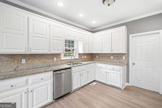 kitchen featuring a sink, stainless steel dishwasher, light wood-type flooring, and crown molding