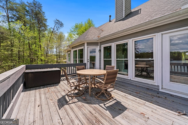 deck featuring outdoor dining area