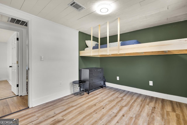 132 4th St, Meldrim, GA 31318 - unfurnished bedroom featuring visible vents, baseboards, wood finished floors, and wooden ceiling