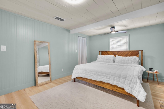 132 4th St, Meldrim, GA 31318 - bedroom with beamed ceiling, wood finished floors, visible vents, and baseboards