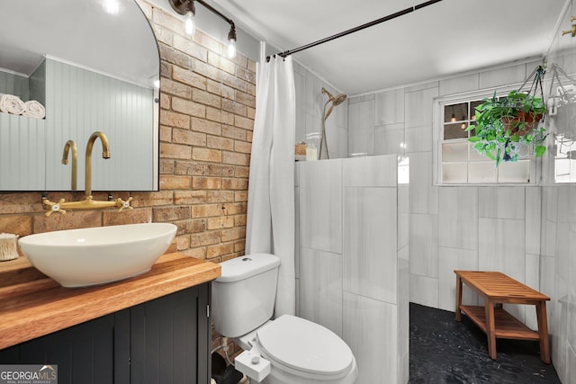 132 4th St, Meldrim, GA 31318 - bathroom with brick wall, toilet, vanity, and a shower with curtain