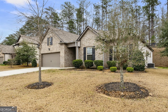 view of front of property with brick siding, driveway, an attached garage, and a front yard