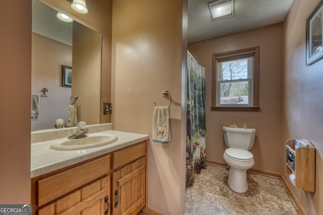 625 Sunnyside Shores Rd, Hiawassee, GA 30546 - full bath with vanity, a shower with shower curtain, baseboards, a textured ceiling, and toilet