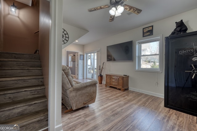 625 Sunnyside Shores Rd, Hiawassee, GA 30546 - living room featuring baseboards, a ceiling fan, wood finished floors, and stairs