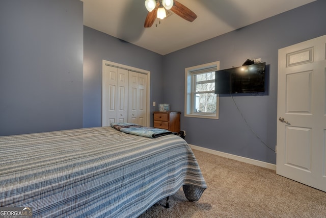 625 Sunnyside Shores Rd, Hiawassee, GA 30546 - bedroom featuring light colored carpet, baseboards, a closet, and ceiling fan