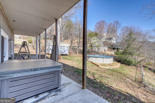 625 Sunnyside Shores Rd, Hiawassee, GA 30546 - view of patio / terrace with a covered pool, an outdoor structure, a shed, and a hot tub