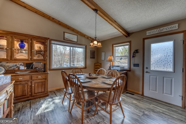 625 Sunnyside Shores Rd, Hiawassee, GA 30546 - dining area with vaulted ceiling with beams, visible vents, light wood-type flooring, and a textured ceiling