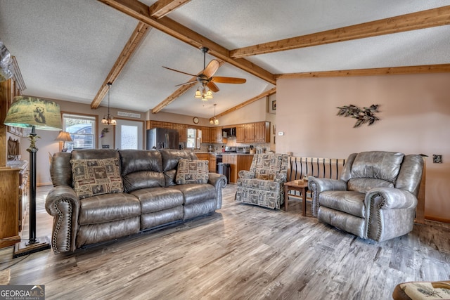 625 Sunnyside Shores Rd, Hiawassee, GA 30546 - living area featuring light wood-style floors, a ceiling fan, vaulted ceiling with beams, and a textured ceiling