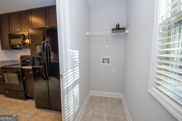 104 Park View Dr, Grantville, GA 30220 - kitchen with baseboards, black appliances, light tile patterned flooring, and dark brown cabinetry