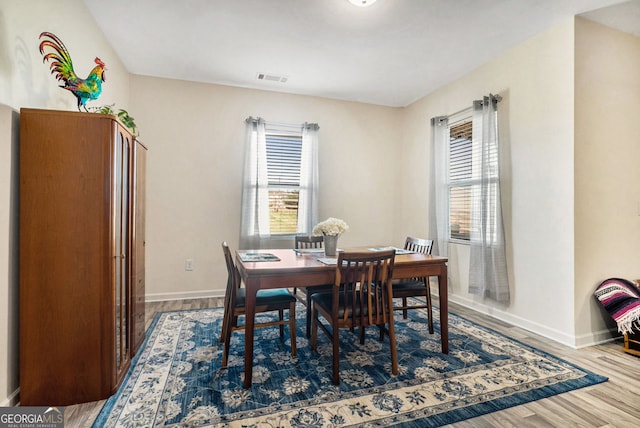 215 Apalachee Dr, Bethlehem, GA 30620 - dining area featuring baseboards, wood finished floors, and visible vents