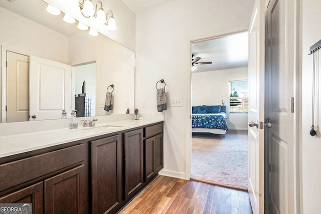 215 Apalachee Dr, Bethlehem, GA 30620 - ensuite bathroom featuring a ceiling fan, wood finished floors, vanity, baseboards, and connected bathroom
