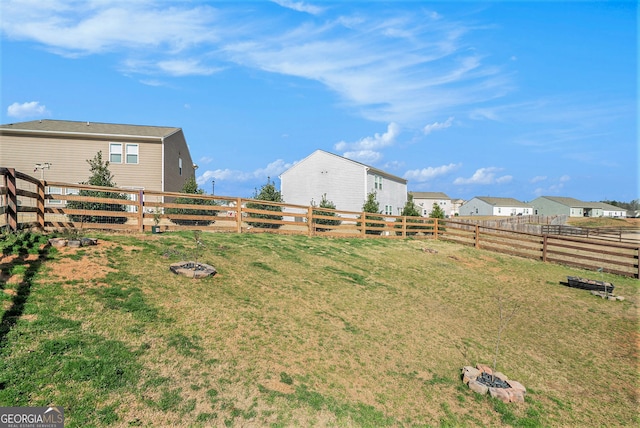 215 Apalachee Dr, Bethlehem, GA 30620 - view of yard featuring a fenced backyard and an outdoor fire pit