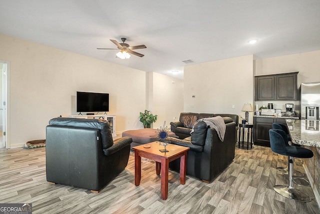 215 Apalachee Dr, Bethlehem, GA 30620 - living room with light wood-type flooring, ceiling fan, and visible vents