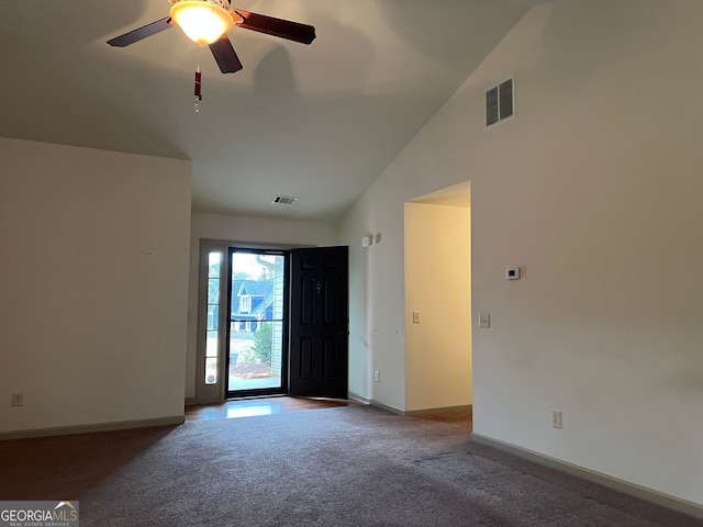 interior space with visible vents, baseboards, ceiling fan, and vaulted ceiling