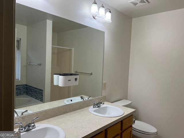 bathroom with visible vents, a sink, a bath, and toilet