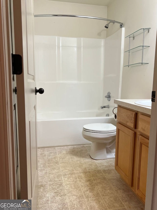 full bath with vanity, toilet, and shower / washtub combination