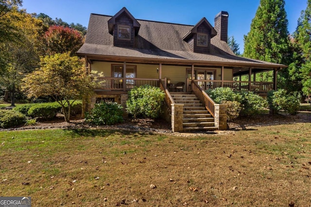 2778 Kelly Ln, Hiawassee, GA 30546 - farmhouse inspired home featuring stairway, a front lawn, a chimney, and covered porch