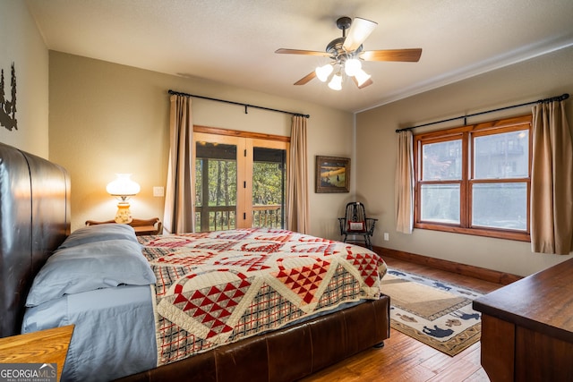2778 Kelly Ln, Hiawassee, GA 30546 - bedroom featuring access to outside, wood finished floors, and a ceiling fan