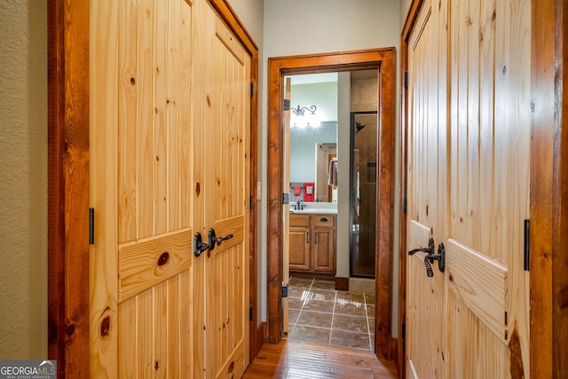2778 Kelly Ln, Hiawassee, GA 30546 - corridor featuring dark wood-style floors and a sink
