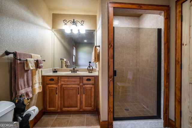 2778 Kelly Ln, Hiawassee, GA 30546 - full bath with a stall shower, vanity, a textured wall, and tile patterned floors
