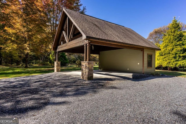 2778 Kelly Ln, Hiawassee, GA 30546 - view of side of home with driveway, roof with shingles, and a carport