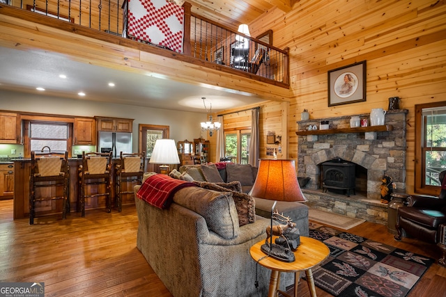 2778 Kelly Ln, Hiawassee, GA 30546 - living area with a chandelier, light wood-type flooring, wooden walls, recessed lighting, and a high ceiling