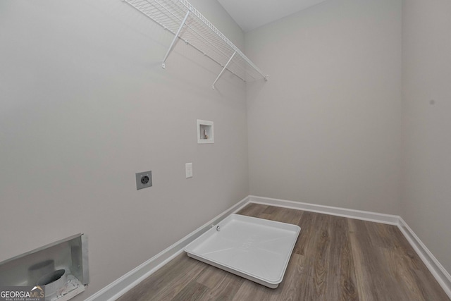 laundry room with washer hookup, wood finished floors, electric dryer hookup, laundry area, and baseboards