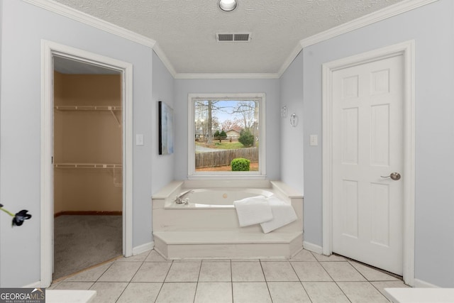 full bath featuring a bath, baseboards, tile patterned flooring, and visible vents