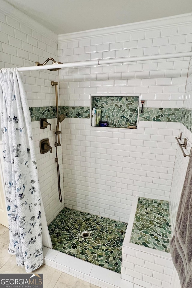 bathroom with a stall shower, tile patterned flooring, and crown molding