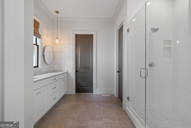 full bath with a shower stall, vanity, crown molding, baseboards, and marble finish floors
