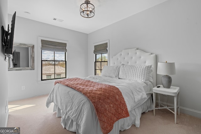 bedroom featuring carpet flooring and baseboards