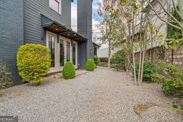 view of yard with french doors