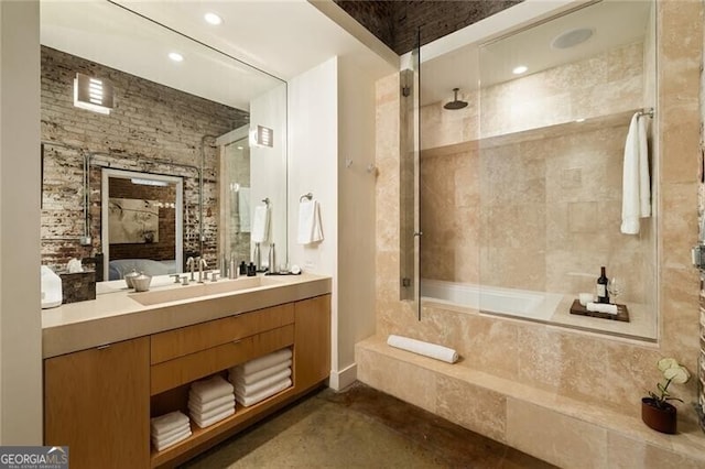 bathroom with vanity and a combined bath / shower with rainfall shower