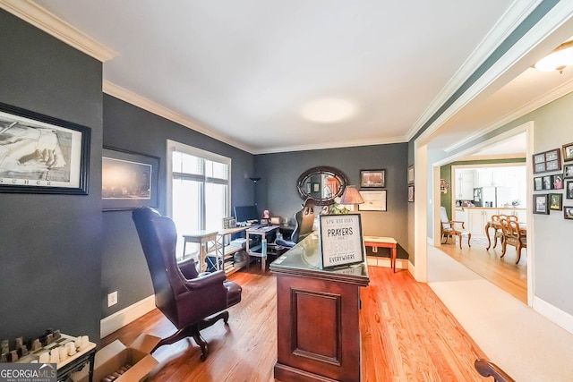 home office featuring baseboards, wood finished floors, and ornamental molding