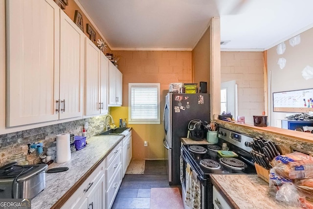 4751 Bill Cheek Rd, Auburn, GA 30011 - kitchen featuring stainless steel electric range oven, white cabinets, crown molding, and tasteful backsplash