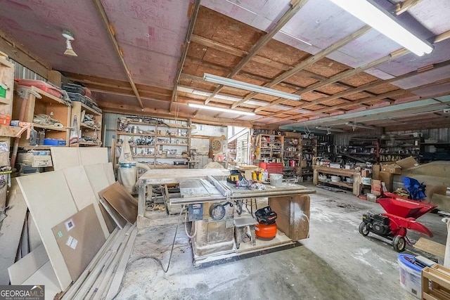 4751 Bill Cheek Rd, Auburn, GA 30011 - miscellaneous room with a workshop area and concrete floors
