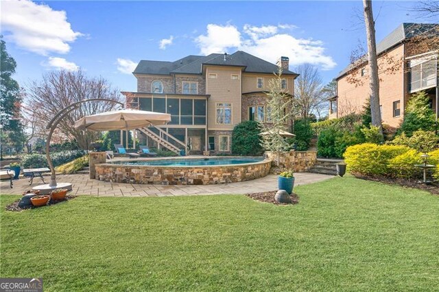 surrounding community with stairs, a yard, and a patio area